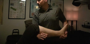 Therapist balancing a person's body